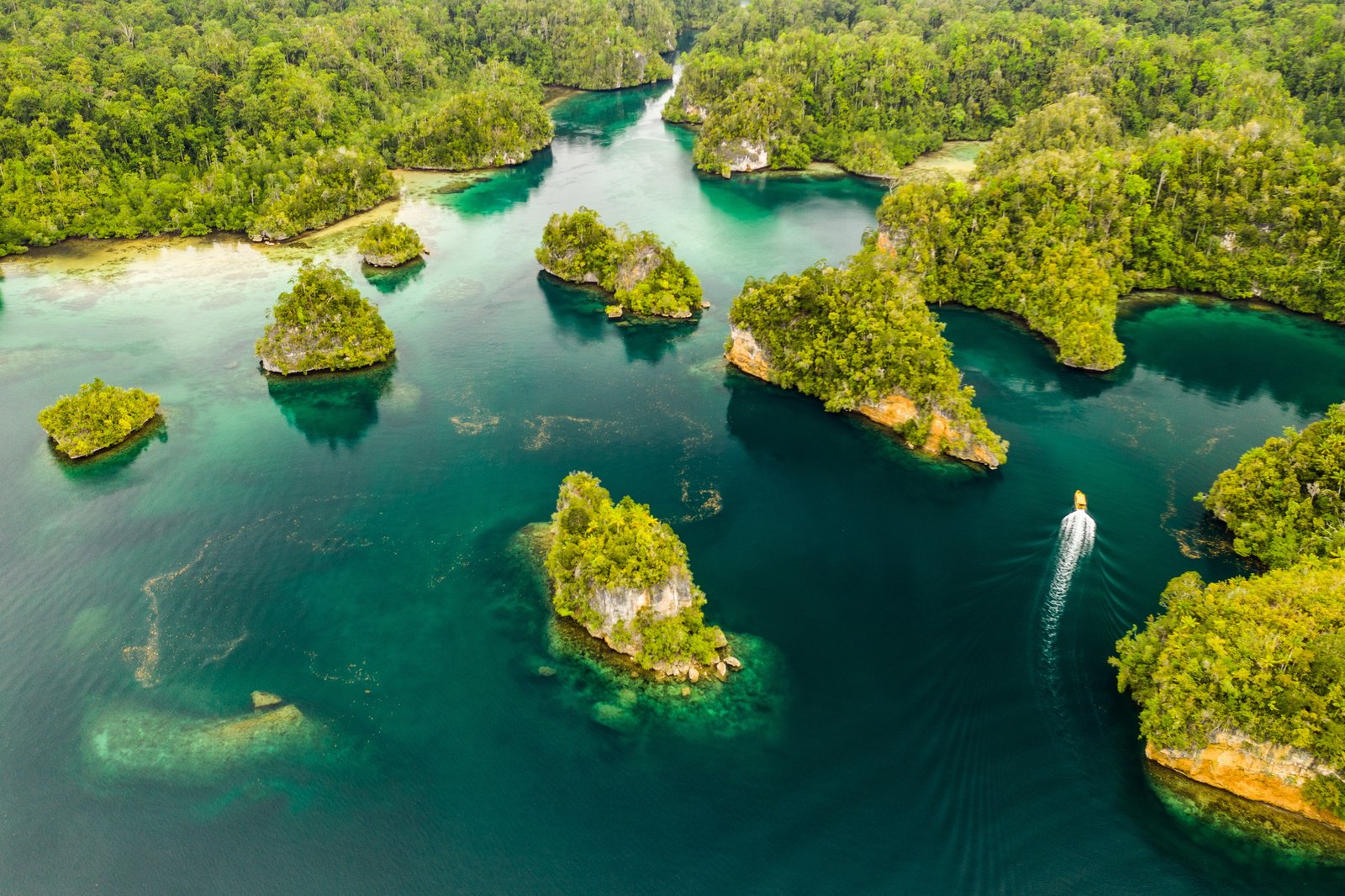 The beauty of Indonesia. High angle shot of a little islets and islands in the middle of Indonesia.